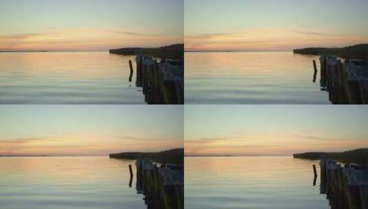 夕阳下平静的海岸边高清在线视频素材下载