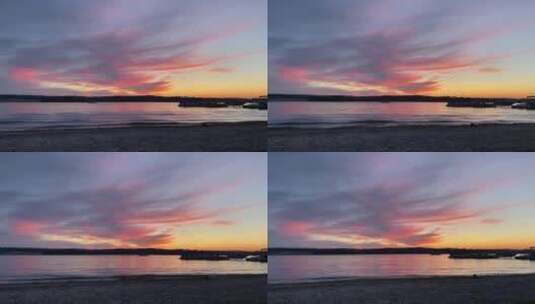 紫色天空下海浪冲击着海滩高清在线视频素材下载