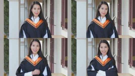 女大学校穿着毕业服微笑高清在线视频素材下载