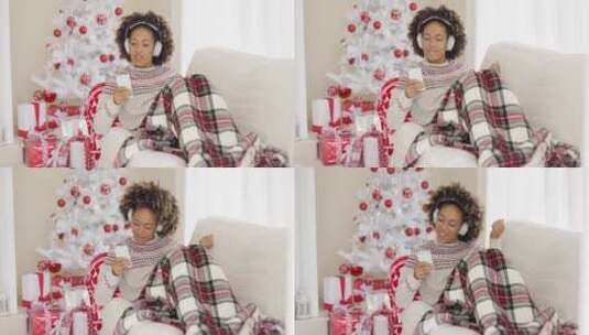 女人在圣诞节戴耳麦听音乐高清在线视频素材下载