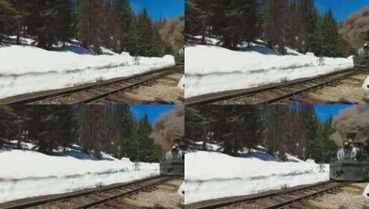 穿过森林雪地的火车高清在线视频素材下载
