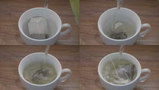 泡茶：用茶包在白杯中倒入热水。高清在线视频素材下载