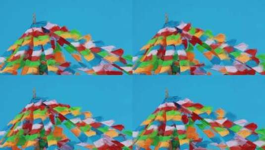 川西藏区蓝天下风吹飘动的经幡近景高清在线视频素材下载