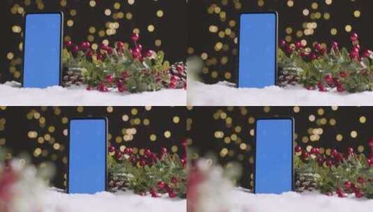 蓝屏手机在圣诞节背景上高清在线视频素材下载