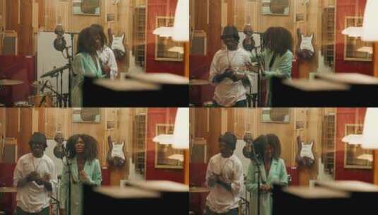 黑人情侣在录音棚唱歌高清在线视频素材下载