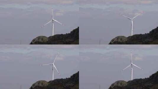 云南红土地丘陵上的风力发电大风车高清在线视频素材下载