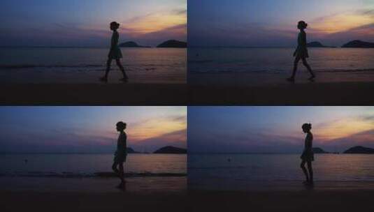 女孩在日落海滩边行走高清在线视频素材下载
