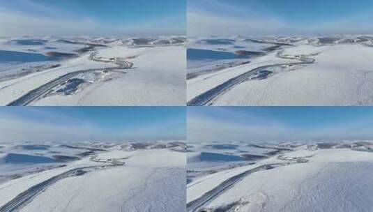 冬季丘陵山区蜿蜒穿行在雪野中的道路高清在线视频素材下载