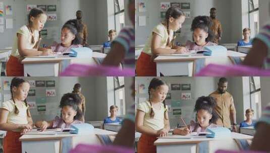 两个女孩在课桌上讨论问题高清在线视频素材下载