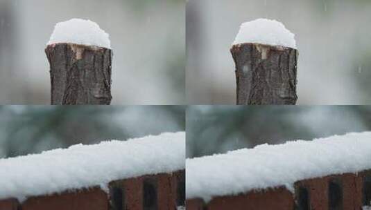 冬天季下雪木桩砖墙积白飘雪皑高清在线视频素材下载