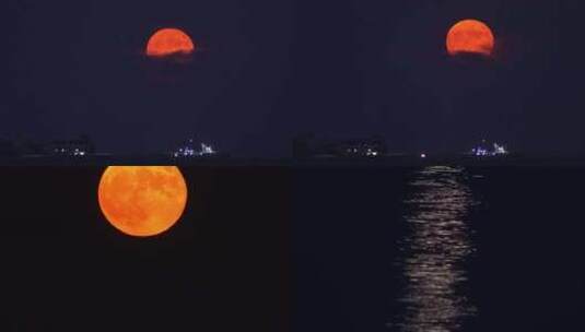 威海湾刘公岛铁码头上空升起的红月亮高清在线视频素材下载