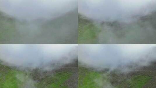 航拍云雾缭绕的川西巴朗山垭口高山草甸风光高清在线视频素材下载