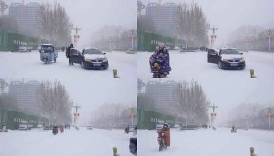4k北方城市下大雪的路口的行人高清在线视频素材下载