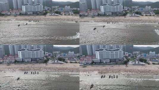 海浪拍打沙滩沙滩游泳游客航拍高清在线视频素材下载