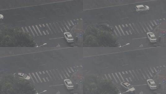俯瞰暴雨中的城市街道街角车辆车流高清在线视频素材下载