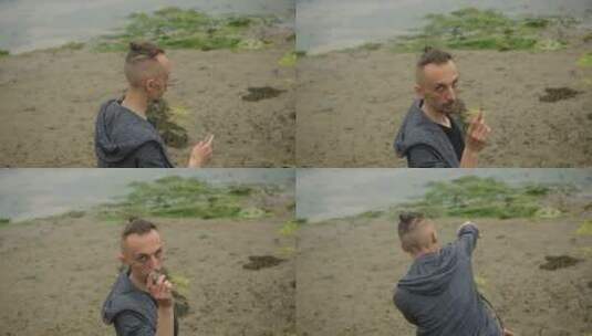 一个人在湖面上扔一块石头高清在线视频素材下载