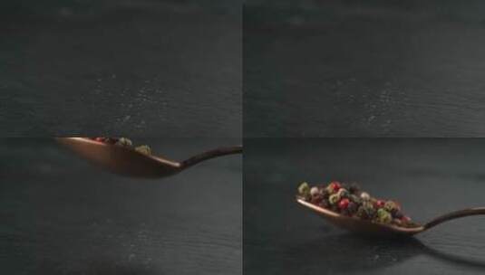 黑胡椒洒落在勺子上的慢镜头高清在线视频素材下载