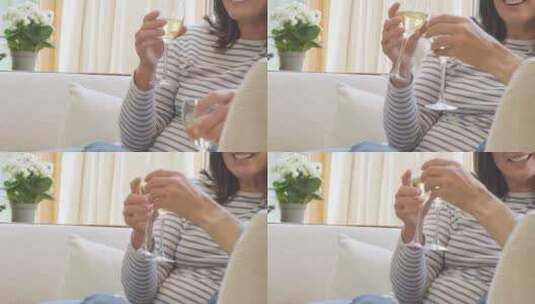 中年夫妇手拿酒杯的特写镜头高清在线视频素材下载