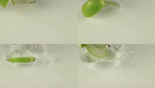 切开的苹果掉落牛奶高清在线视频素材下载