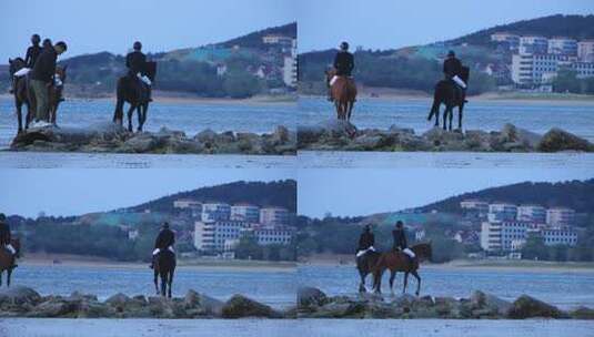 威海日落湾沙滩上策马奔腾的骑手高清在线视频素材下载