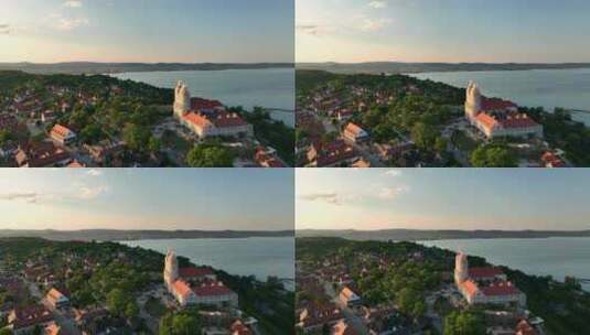 俯瞰匈牙利巴拉顿湖的蒂哈尼村鸟瞰图-日落高清在线视频素材下载