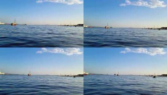 亚得里亚海海岸斯普利特港的蓝色海面，背景中航行的船只，克罗地亚高清在线视频素材下载