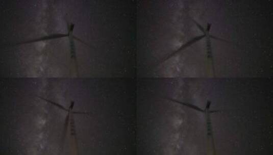 星空下风力发电机风轮运转视频高清在线视频素材下载