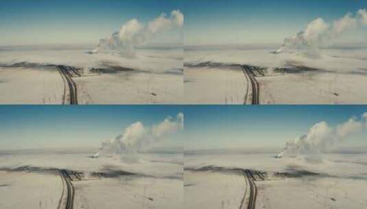 在冬季云雾缭绕中繁忙运转的热电站航拍高清在线视频素材下载