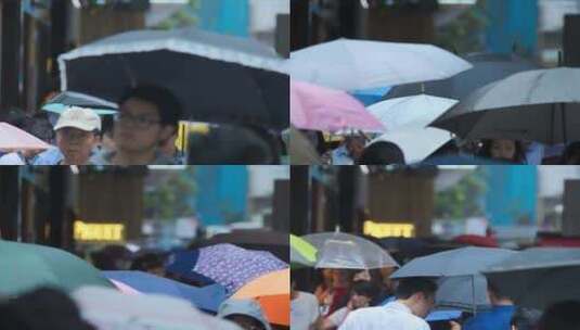 街道上人来人往的雨伞高清在线视频素材下载