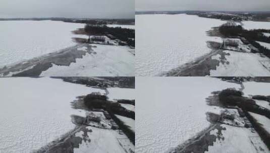 波兰苏瓦基冬天结冰的湖泊。空中攀登高清在线视频素材下载