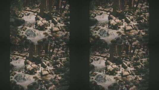 河流在森林8毫米电影风格的岩石上瀑布高清在线视频素材下载