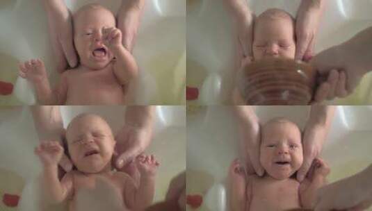 家人给新生儿洗澡高清在线视频素材下载
