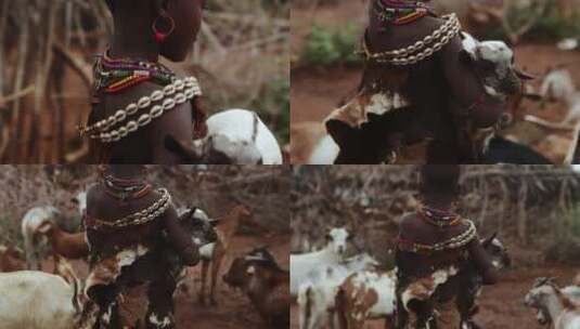 穿传统服饰抱小羊的女孩高清在线视频素材下载