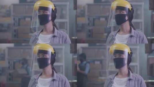 疫情时女人戴着防护面罩工作高清在线视频素材下载