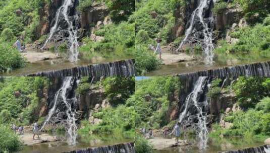 济南市历城黄巢水库，高空流水而下形成瀑布高清在线视频素材下载