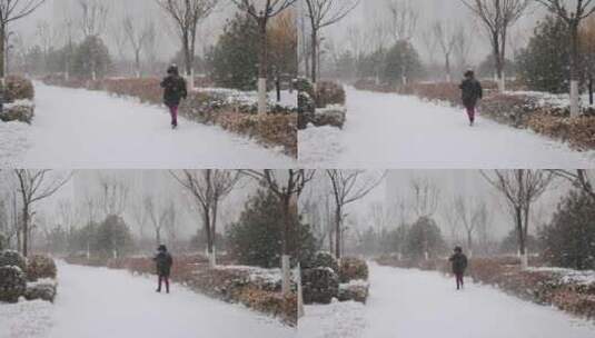 大雪纷飞中孤独行走的人背影高清在线视频素材下载