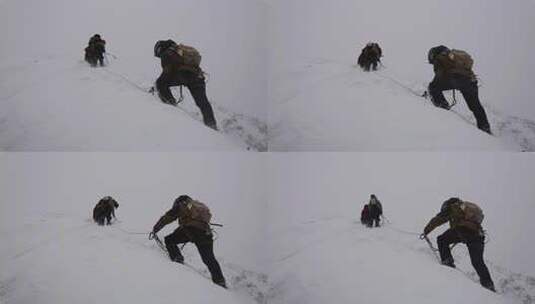 风雪中攀登四川贡嘎山区贡巴峰的登山者高清在线视频素材下载