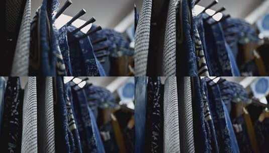 挂架上的各式纺织布料高清在线视频素材下载