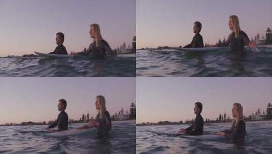 情侣手扶冲浪板的特写镜头高清在线视频素材下载