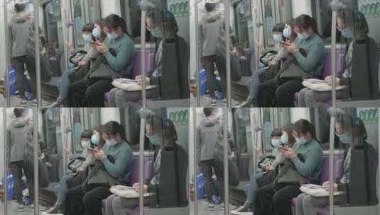 戴口罩坐地铁玩手机高清在线视频素材下载