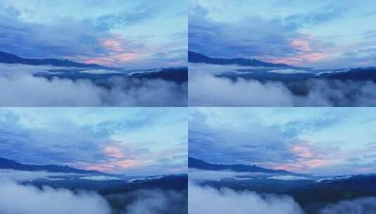穿过云层看夕阳下的山川高清在线视频素材下载