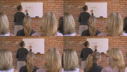 女教师在黑板上板书授课高清在线视频素材下载