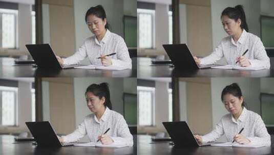 职业女性在电脑上工作，用笔记录高清在线视频素材下载