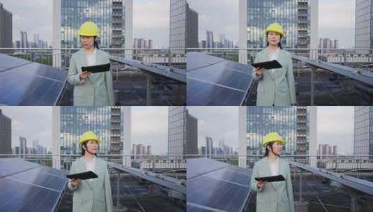 女性工程师拿着平板电脑在屋顶光伏发电站高清在线视频素材下载