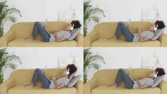 女性躺在沙发上用电脑视频通话高清在线视频素材下载