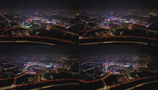 航拍扬州西区明月湖大桥夜景京华城商圈全景高清在线视频素材下载