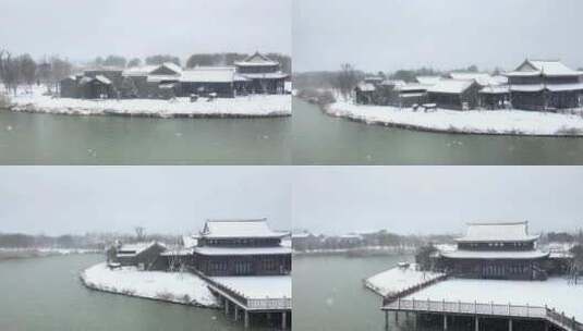 航拍北湖湿地公园雪景湖泊古建筑江南下雪高清在线视频素材下载