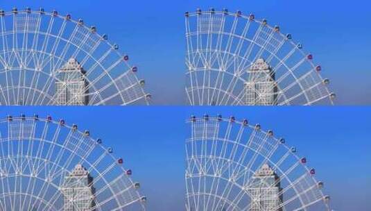 城市蓝天下的摩天轮航拍高清在线视频素材下载