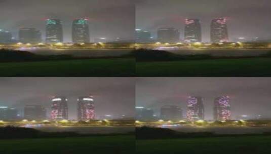 夜晚大雨中的成都金融城双子塔灯光秀高清在线视频素材下载