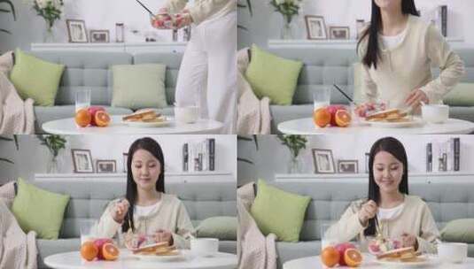 一位年轻女士在家吃早餐高清在线视频素材下载